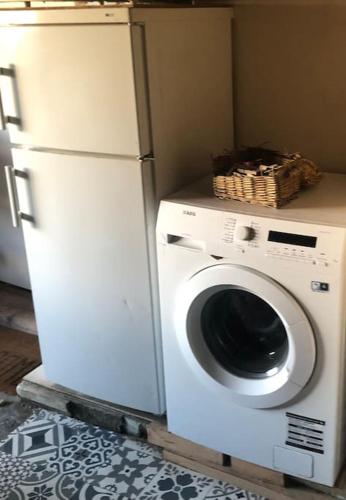 a washing machine with a basket on top of it at Appartement voor twee personen in Twisk