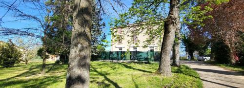 a house in the middle of a field with trees at Daisy Bucolique #Parking #Terrasse #Calme in Irigny