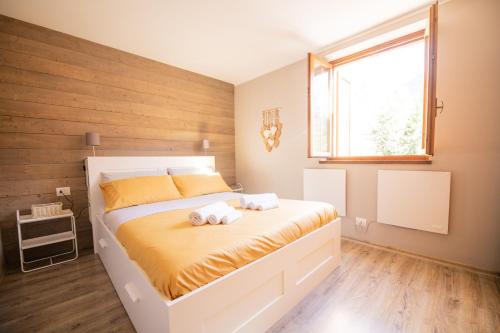 Postel nebo postele na pokoji v ubytování Maison Foppolo A due passi dalla Funivia