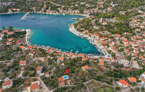 an aerial view of a harbor with boats in the water at Two-Bedroom Holiday Home In Drvenik Veli in Veliki Drvenik