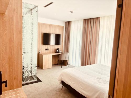 TV a/nebo společenská místnost v ubytování CM111Apparthotel