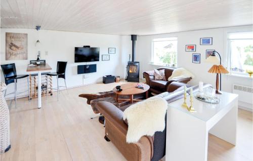 a living room with a couch and a table at Two-Bedroom Holiday Home In Hornslet in Hornslet