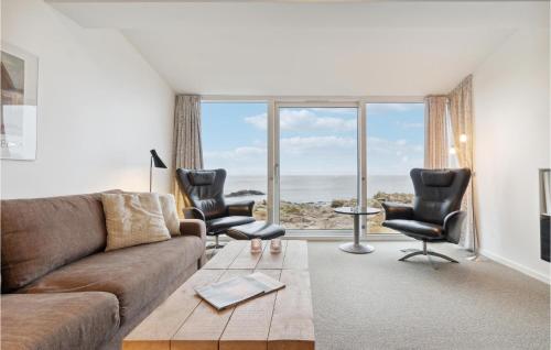 a living room with a couch and two chairs at Lovely Apartment In Allinge With Wifi in Allinge