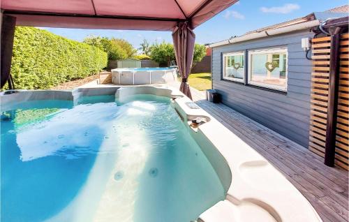a hot tub on the deck of a house at Nice Home In Helsingborg in Helsingborg