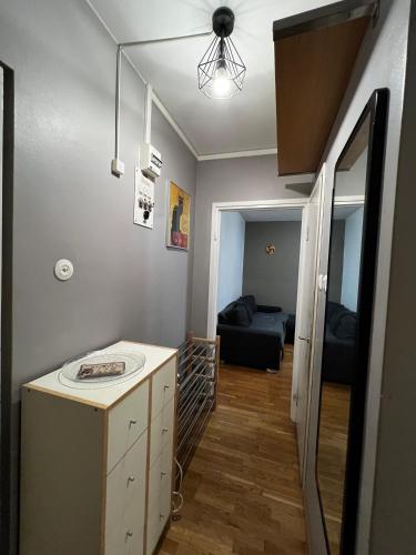 a room with a kitchen and a living room at MP Kallio Apartment Helsinki in Helsinki