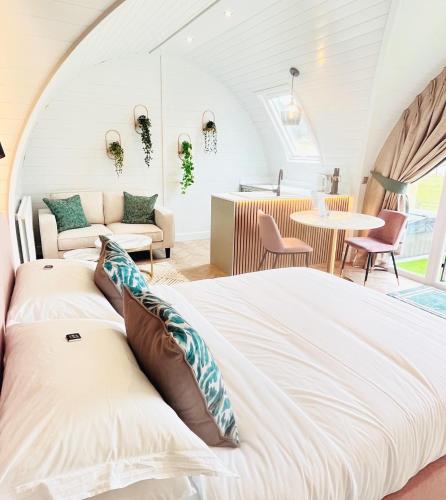 a bedroom with a bed and a living room at Mingarry Park in Acharacle