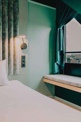 Postel nebo postele na pokoji v ubytování ibis Styles Hasselt City Centre