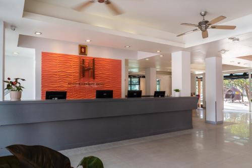 a lobby of a hotel with a reception desk at Heeton Concept Hotel Pattaya by Compass Hospitality in Pattaya