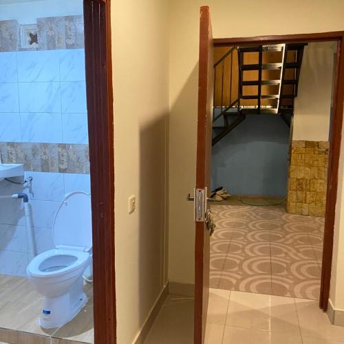 a bathroom with a toilet and a bunk bed at Labuan Bajo room in Labuan Bajo