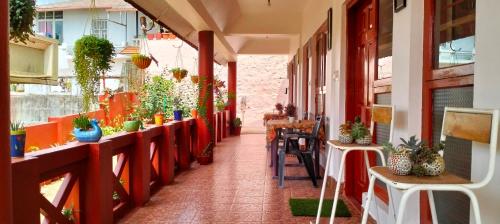 a corridor of a building with plants at Holidayincoorg - Brick lane in Madikeri