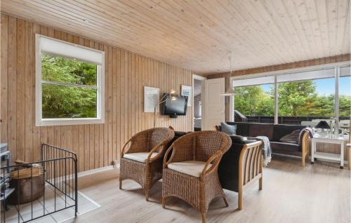 a living room with a couch and chairs at 3 Bedroom Awesome Home In Saltum in Saltum