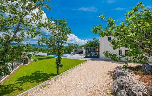 a view of a house with a yard at 4 Bedroom Stunning Home In Grubine in Grubine
