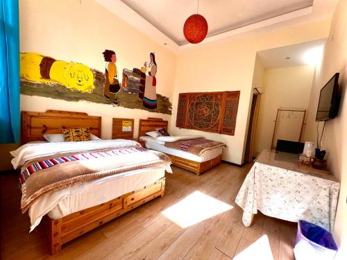 Katil atau katil-katil dalam bilik di Shangri-La Chudengshuo Homestay楚登硕民宿