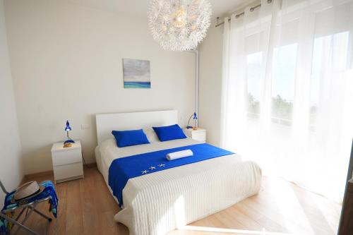 A bed or beds in a room at Appartamento Bellariva B2 - MyHo Casa