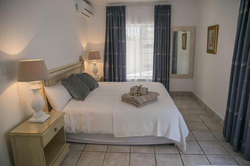 Postel nebo postele na pokoji v ubytování Sunshowers Ballito