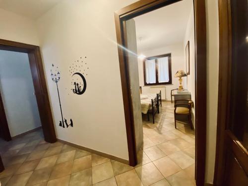 a door to a room with a dining room with a table at Casa Vacanze Barbara in Sant Arcangelo