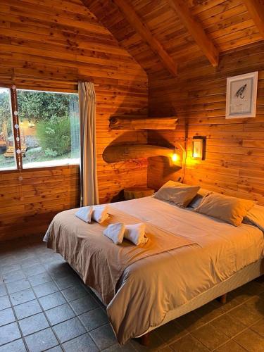 Letto o letti in una camera di Costa Traful
