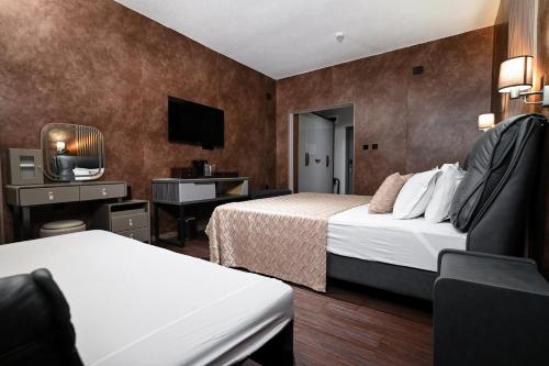 Postel nebo postele na pokoji v ubytování Grey Star Hotel