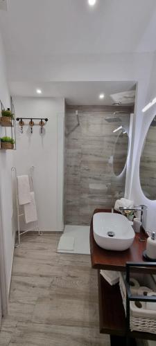 a bathroom with a sink and a mirror at La casa di Agnese in Fiuggi