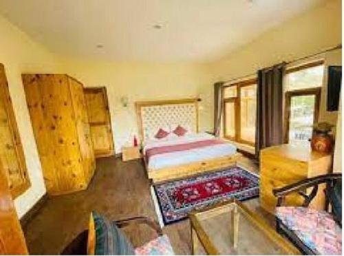 a bedroom with a bed in a room at Hotel DE Suzain-Leh in Leh