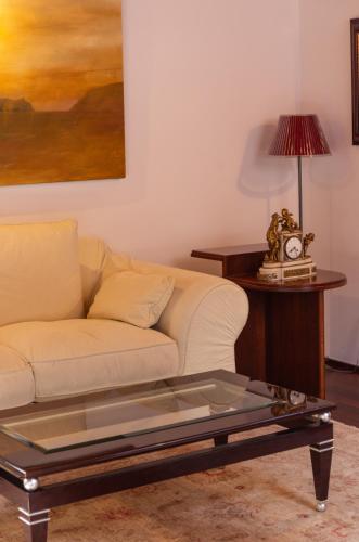 a living room with a couch and a coffee table at Mirador de Dalt Vila-Relais & Chateaux in Ibiza Town