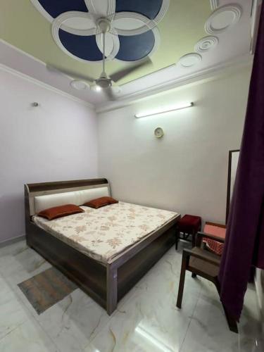 Postel nebo postele na pokoji v ubytování Vaidehi Guest House