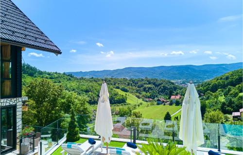 a view from the balcony of a house with umbrellas at Lovely Home In Donja Stubica in Donja Stubica