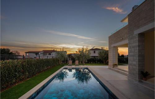a swimming pool in the backyard of a house at Villa Santina in Vabriga