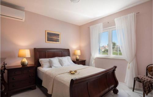 a bedroom with a bed and a window at Villa Karla Nin in Nin