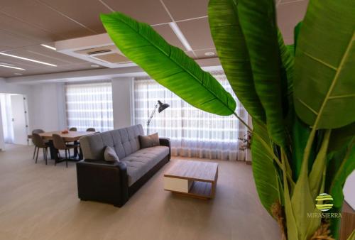 a living room with a couch and a table at Mirasierra in Mancha Real