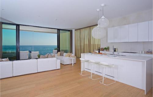a kitchen and living room with white furniture at Villa Lorena in Novigrad Istria