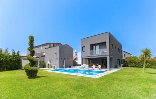 an exterior view of a house with a swimming pool at Villa Lux in Donji Zemunik