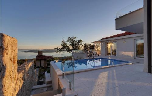 a villa with a swimming pool and a house at Villa Prestige in Baška Voda