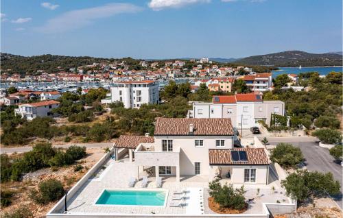 an aerial view of a house with a swimming pool at Villa Stina Murter in Jezera