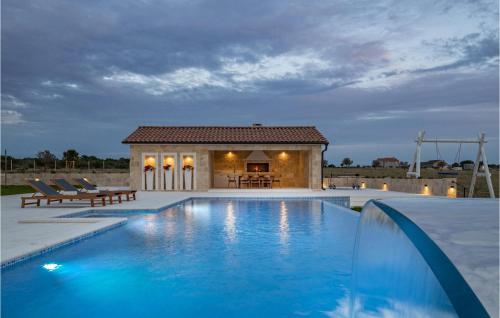 a villa with a swimming pool and a house at Villa Viliska in Sveti Filip i Jakov