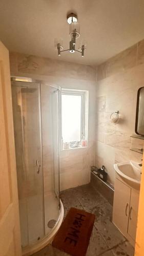 a bathroom with a shower and a sink at A Home away from Home in Birmingham