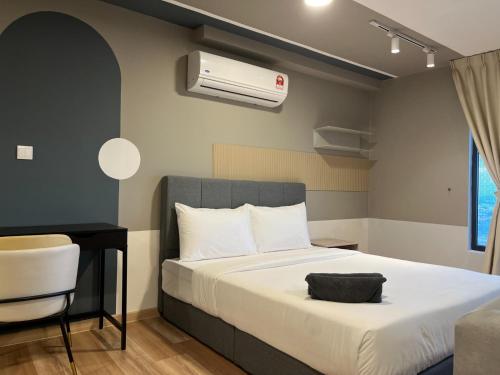 a bedroom with a bed and a air conditioner at Arte cherass by Sweet home in Kuala Lumpur