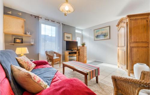 a living room with a couch and a table at 2 Bedroom Stunning Home In Fécamp in Fécamp