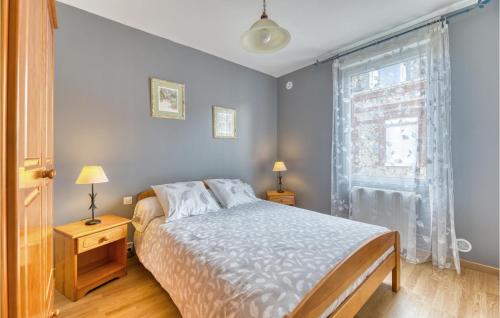 a bedroom with a bed and a window at 2 Bedroom Stunning Home In Fécamp in Fécamp