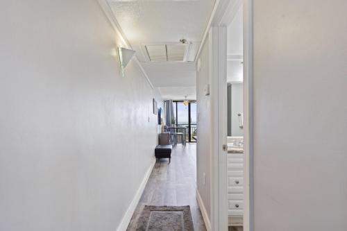a hallway with white walls and a white ceiling at Spectacular Oceanview Condos in Myrtle Beach