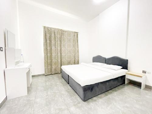 Postel nebo postele na pokoji v ubytování Warsan Star Residence - Home Stay