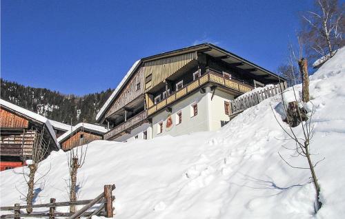 a building on top of a snow covered slope at Ferienhaus In Maria Luggau in Maria Luggau