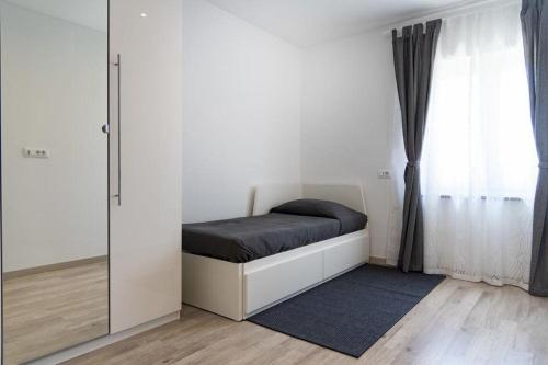 Posteľ alebo postele v izbe v ubytovaní Apartment Roma