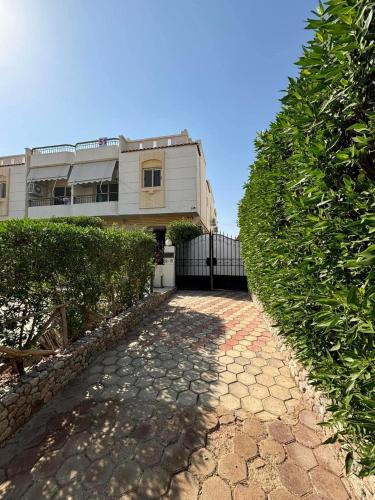 a house with a stone path in front of a building at Casa Do Cairo-Sharm Alsheikh in Sharm El Sheikh