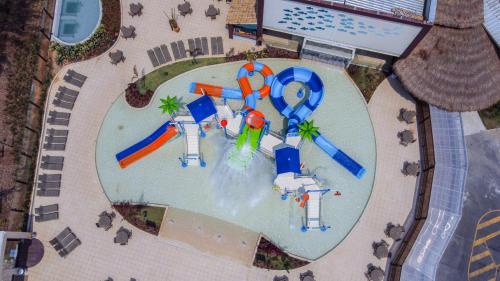an aerial view of a water park with a water slide at Hotel Vilarejo Praia in Rio das Ostras