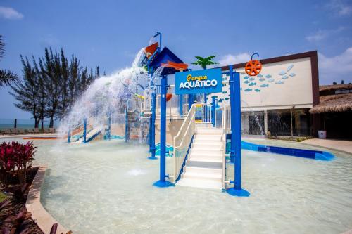 a water slide in the middle of a water park at Hotel Vilarejo Praia in Rio das Ostras