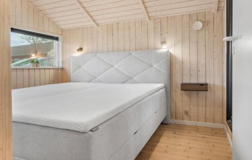 a bedroom with a bed in a room with a window at 2 Bedroom Gorgeous Home In Dannemare in Dannemare