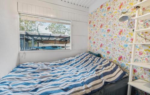 a bedroom with a bed and a window at Awesome Home In Asnæs With Wifi in Asnæs