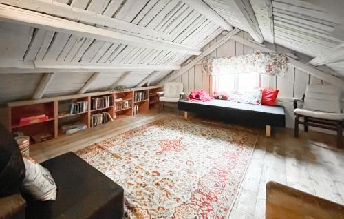 a living room with a couch and a window at 2 Bedroom Stunning Home In Öxnevalla in Gunnabo