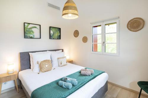 a bedroom with a bed with two stuffed animals on it at Villa Zeruko Izarra, Grand standing in Sare